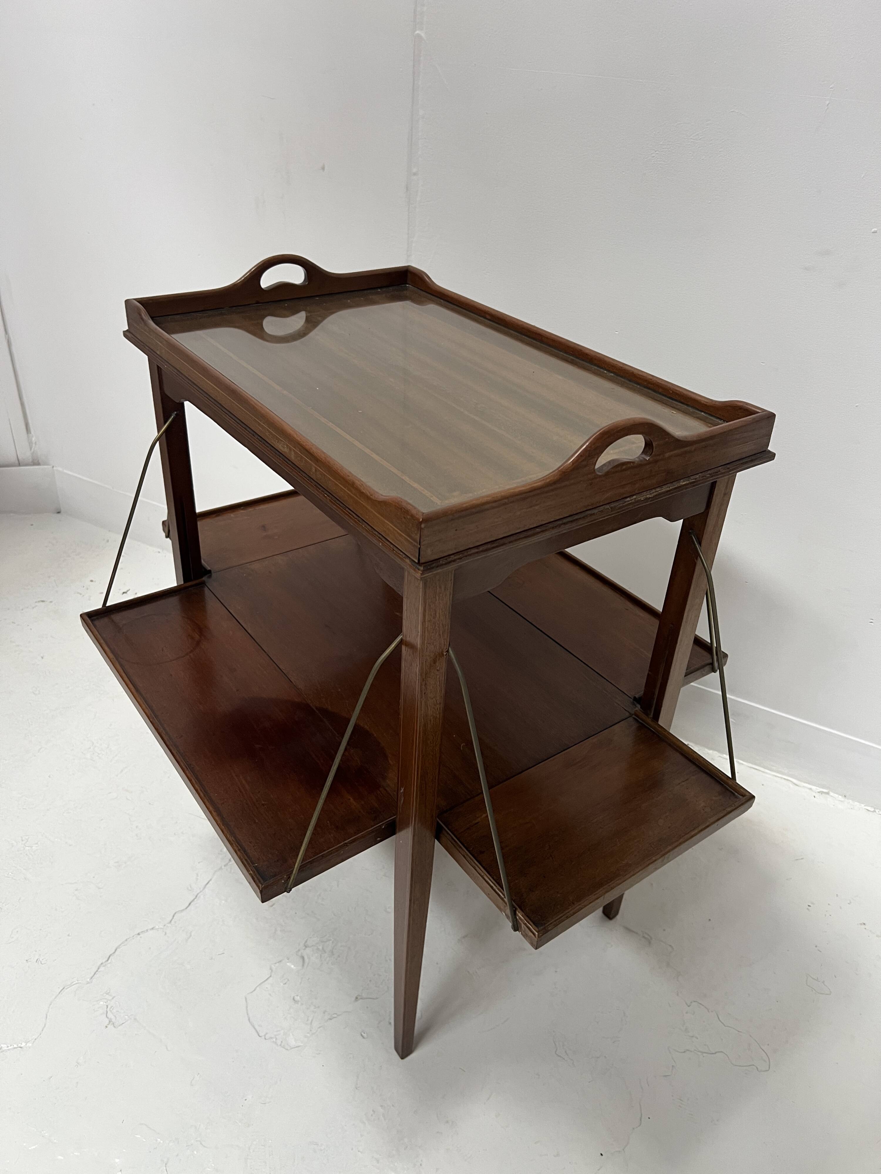 Mahogany serving table with marquetry inlay decoration, 20th century.