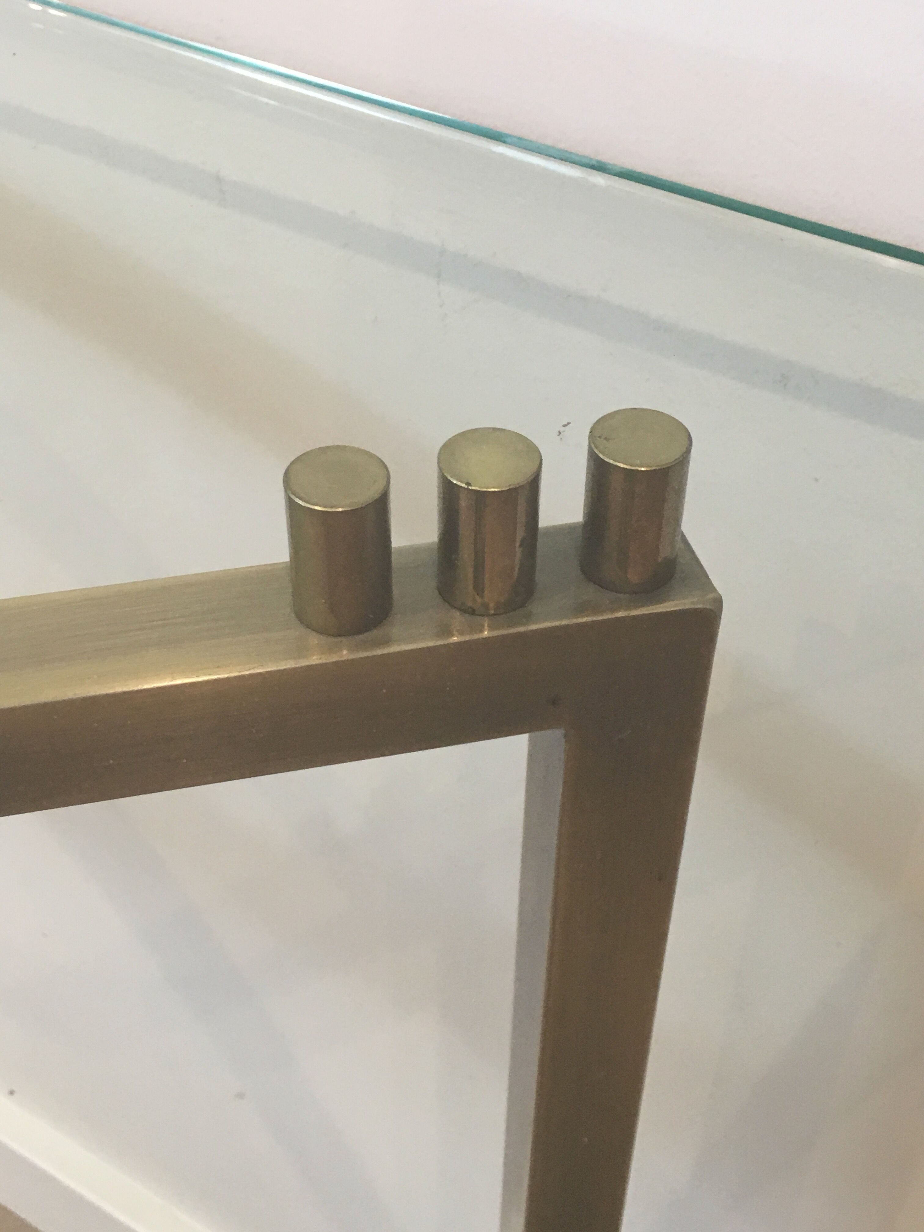 Console in brushed steel and brass and tray formed of a glass slab. French work. Around 1970