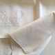 pair of AP monogram towels in cold linen