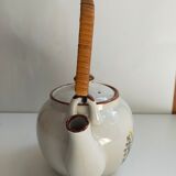 Flowered stoneware teapot with vintage rattan handle