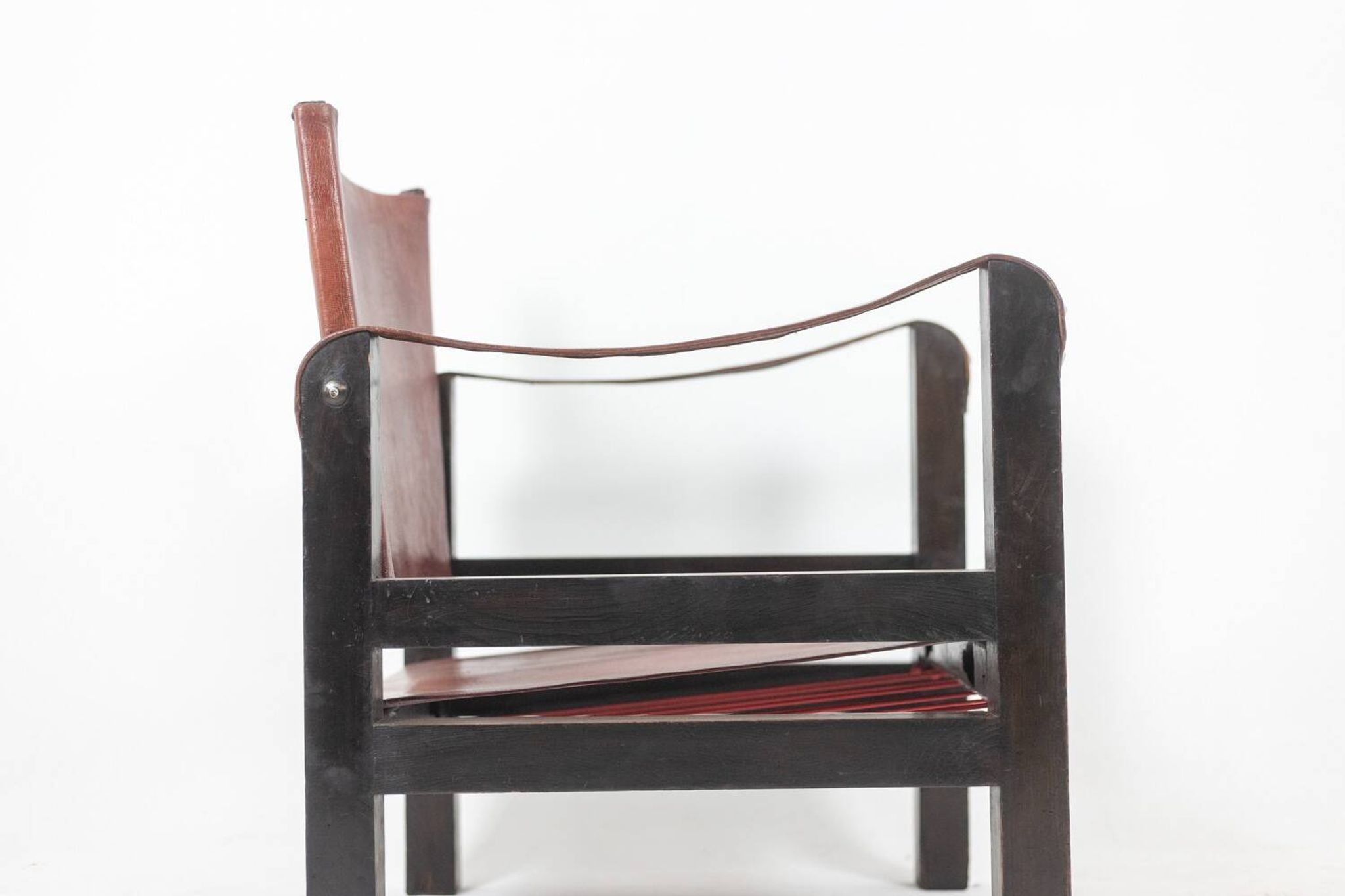 “Safari” armchair in wood and cognac leather. 1960s/70s.