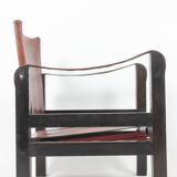 “Safari” armchair in wood and cognac leather. 1960s/70s.