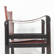 “Safari” armchair in wood and cognac leather. 1960s/70s.