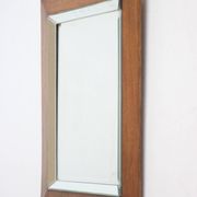 Art deco beveled mirror in an oak frame, 1940s.