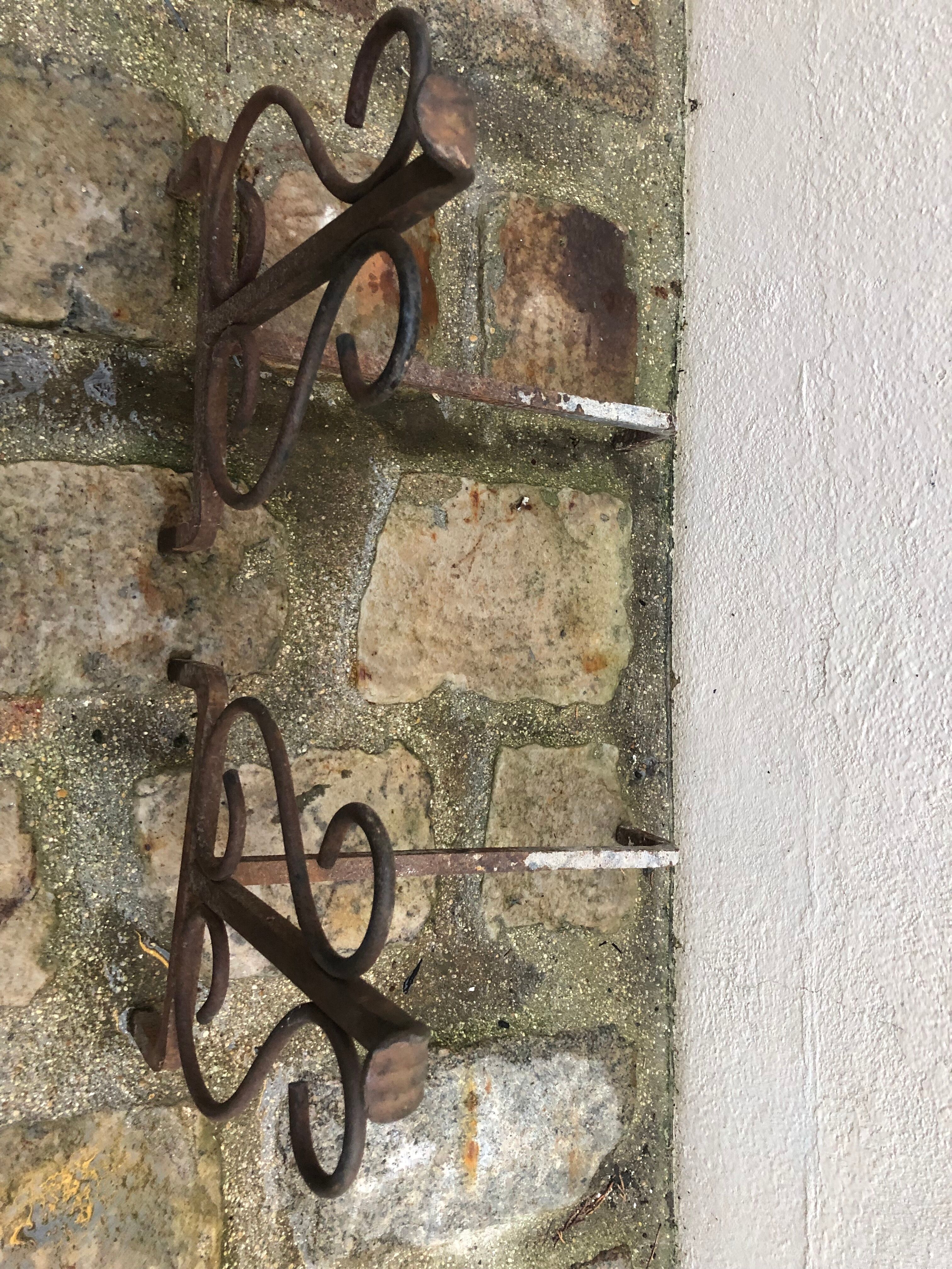 Pair of wrought iron pegs
