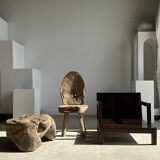 Small low armchair in varnished brown wood