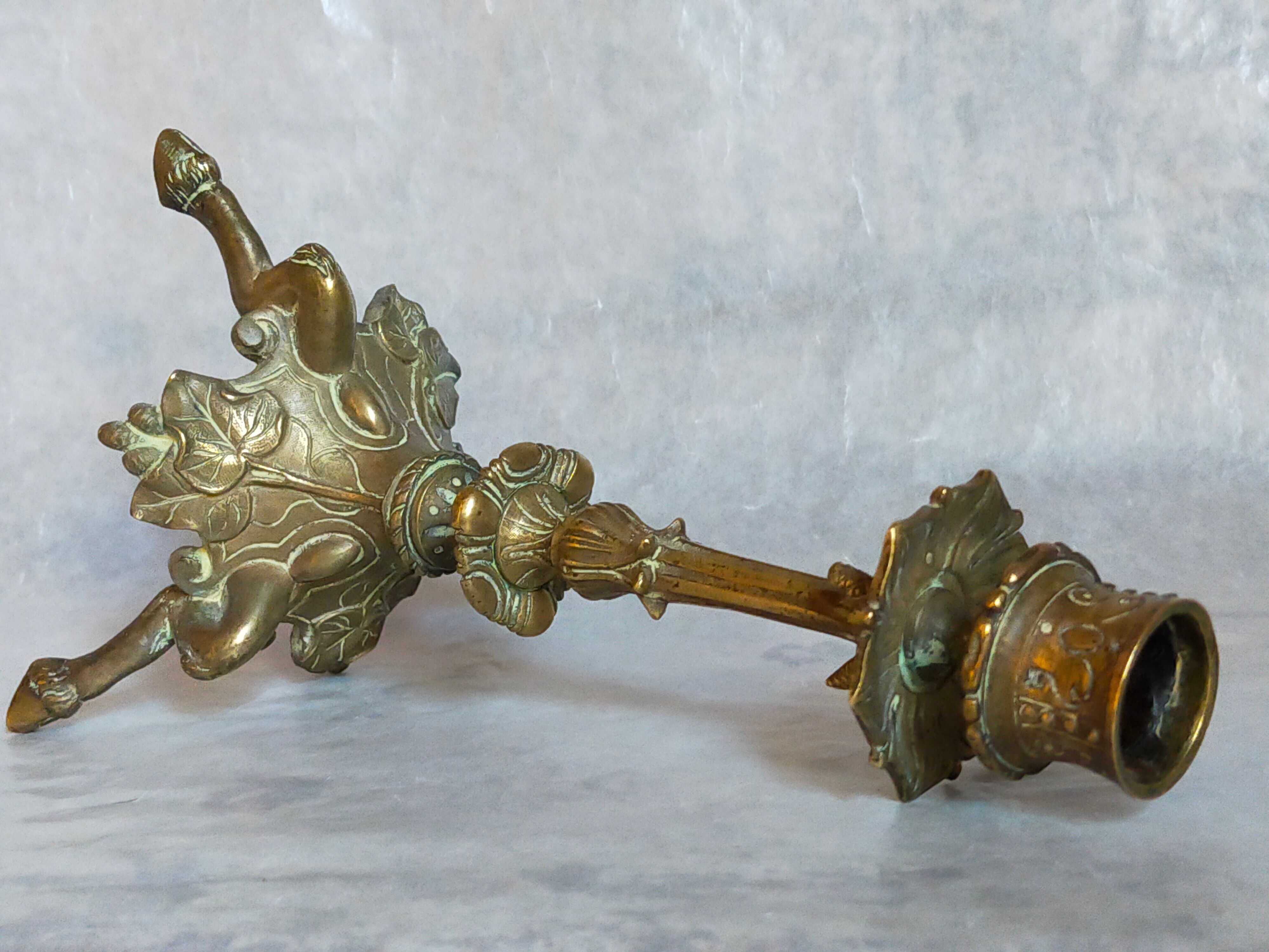 Candle holder in gilded bronze tripod nineteenth century