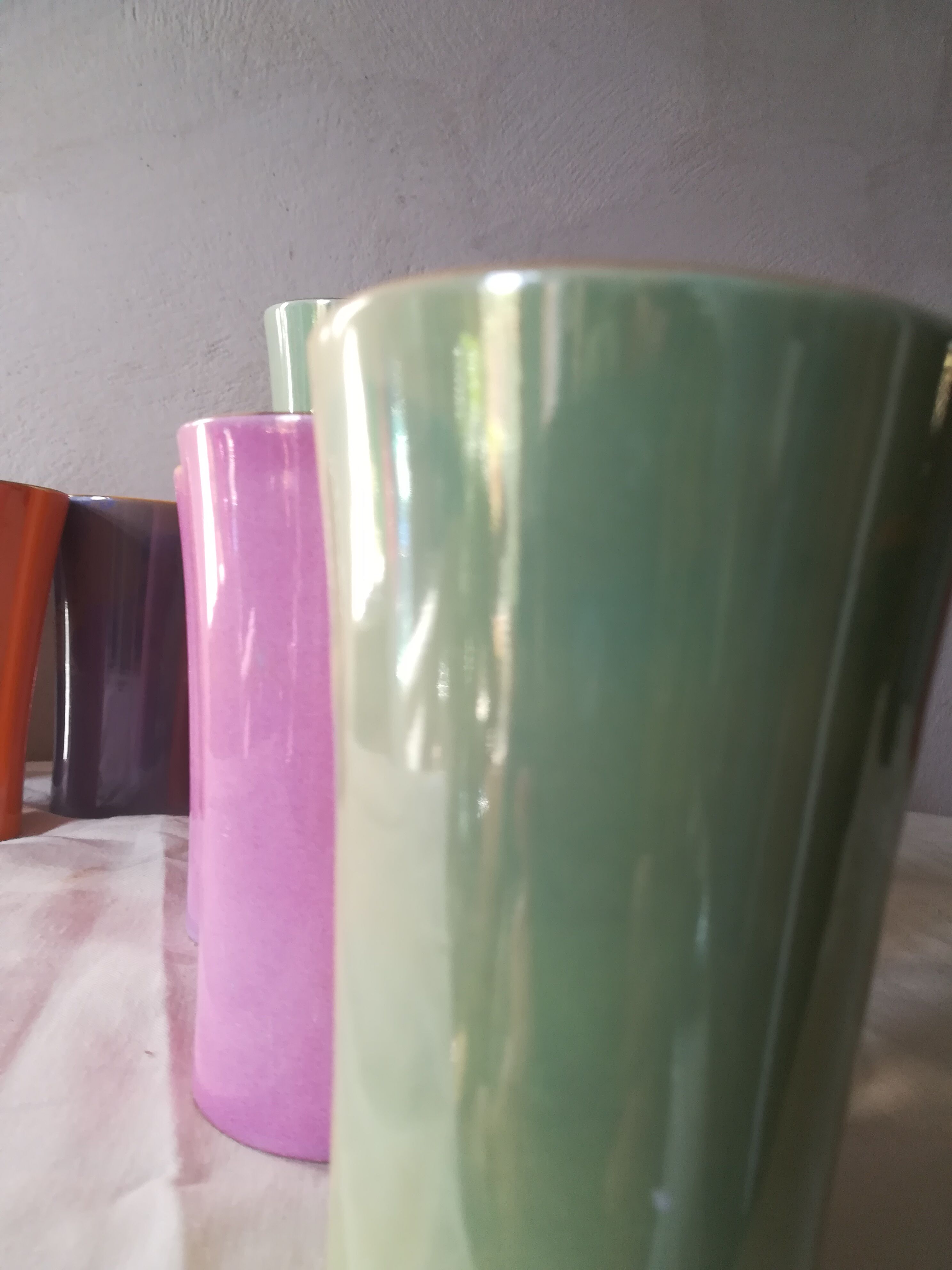 8 coloured cups in earthenware