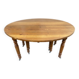 8-legged ash table with 6 extensions.