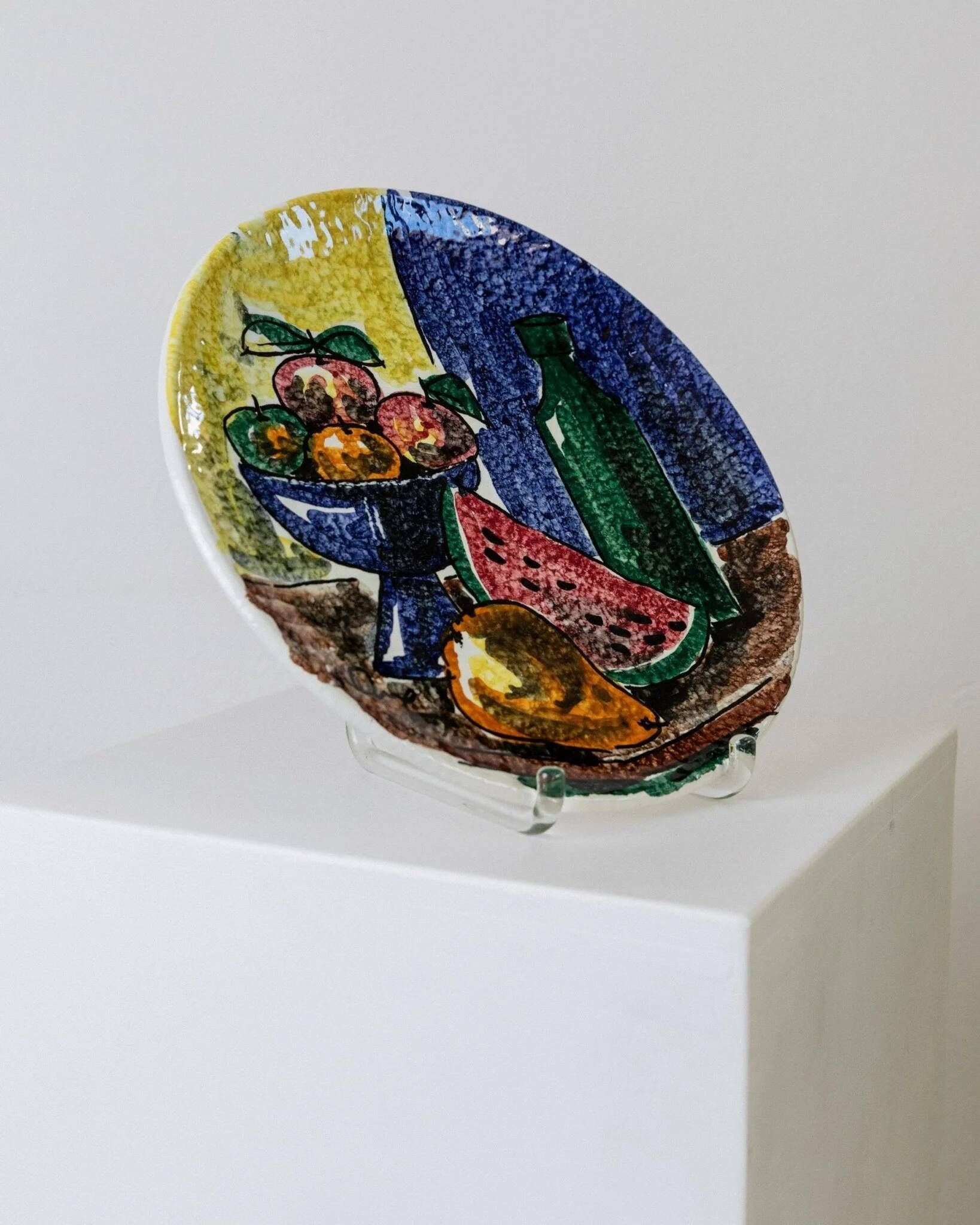 Multicolored hand-painted ceramic wall plate with 1960s Italian fruit motif, signed Stile
