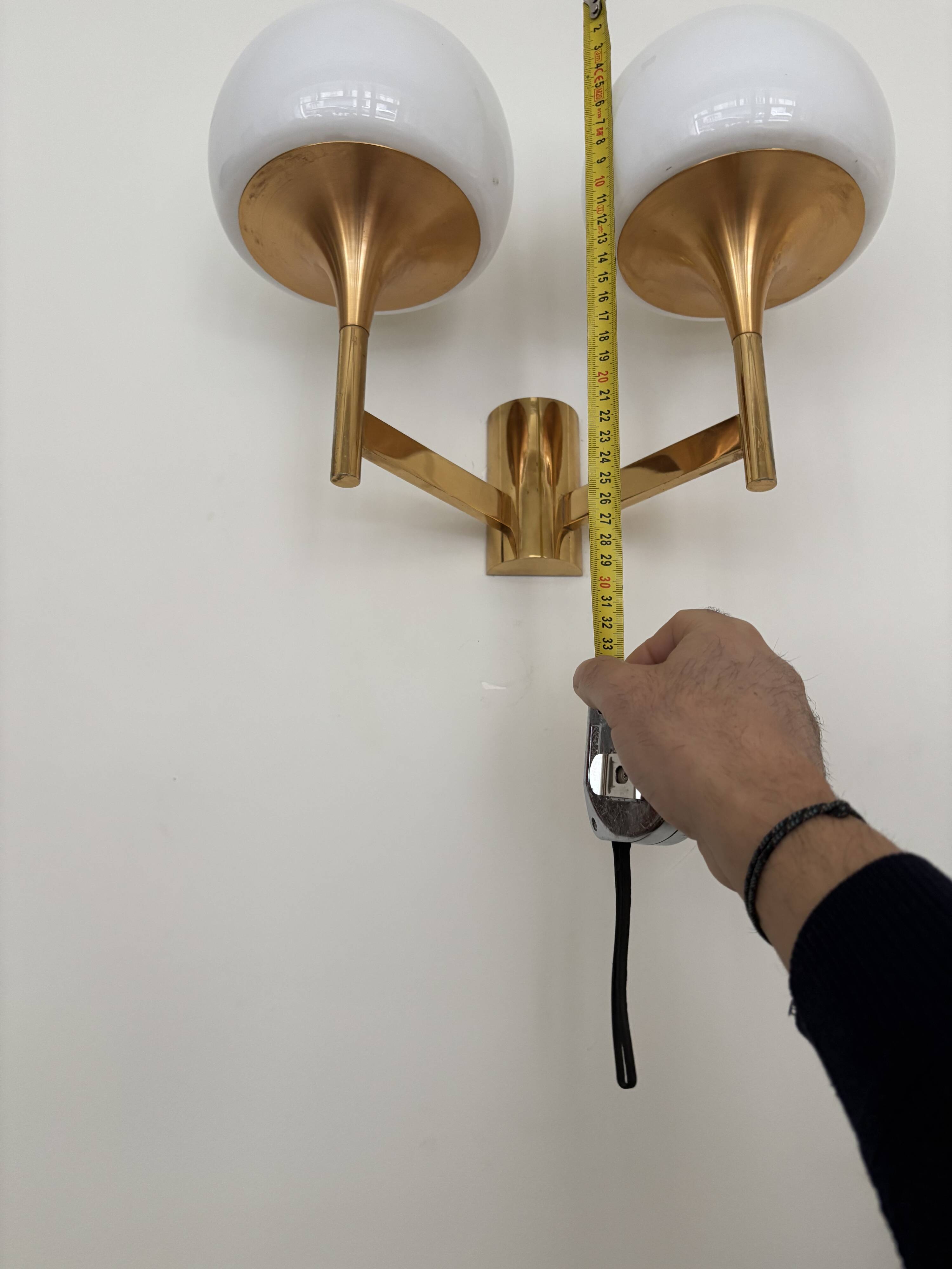 Golden metal wall light and opaline, 1970