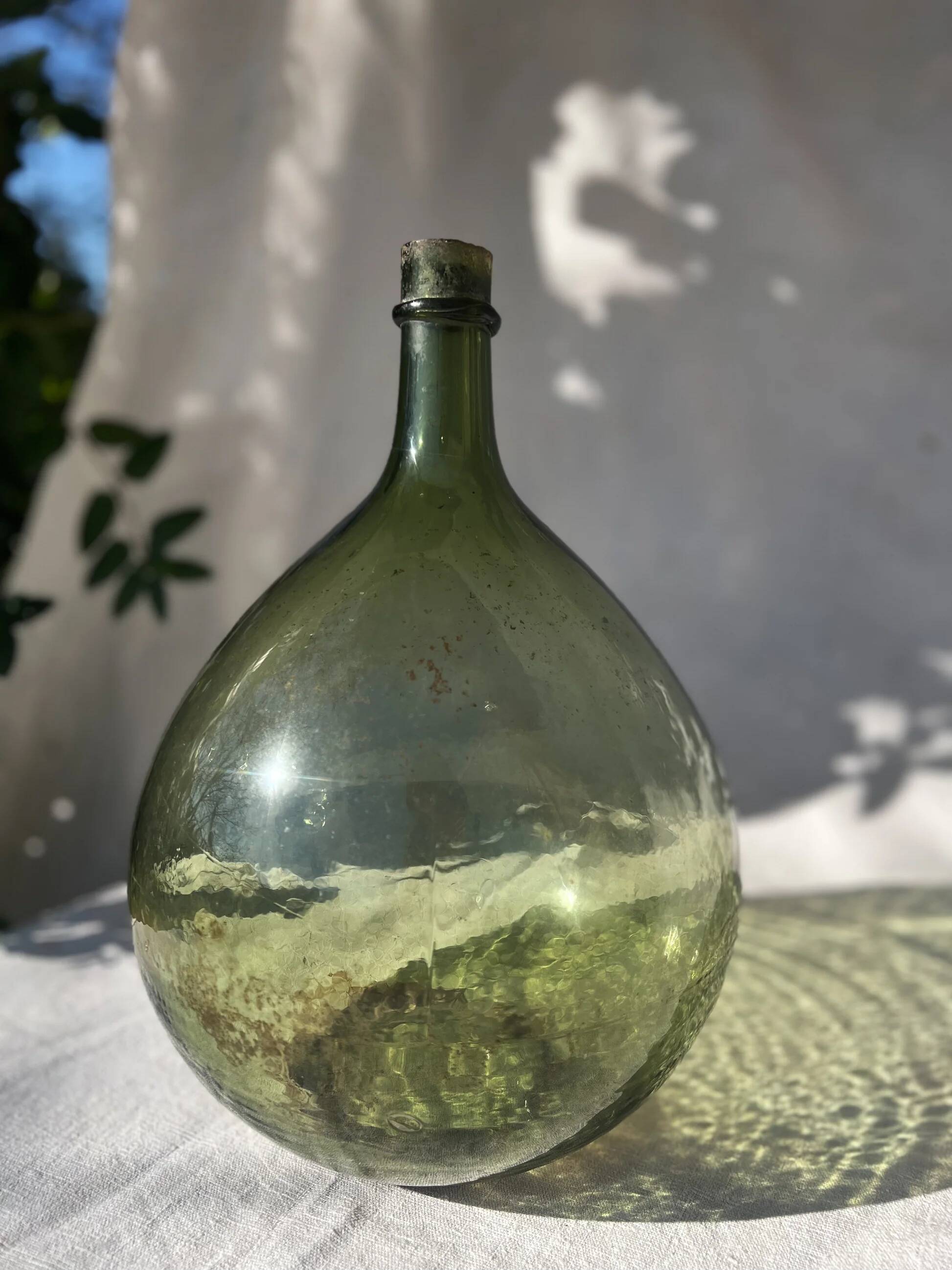Large French green glass demijohn