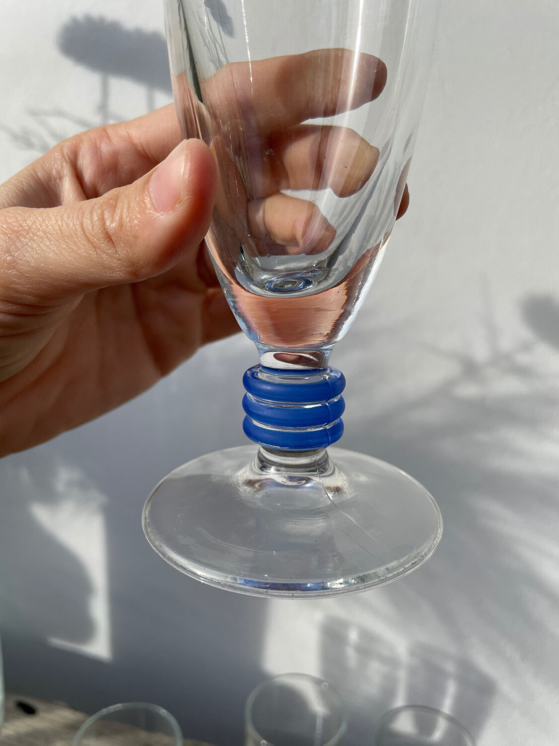 6 clear champagne flutes with blue stems, designer style