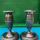 Pair of Louis XVI style candlesticks in silvered bronze