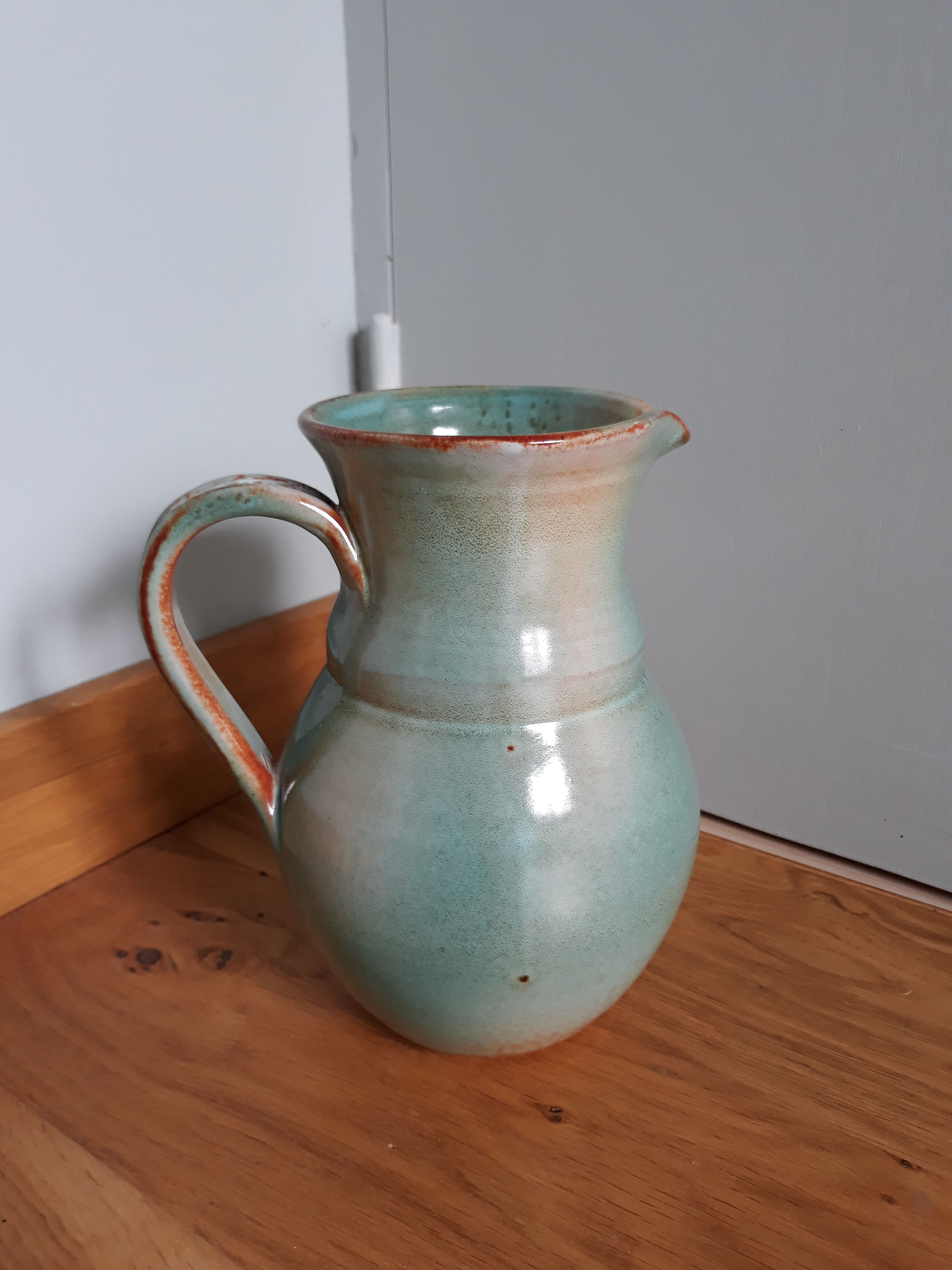 Pitcher with handle green celadon turquoise and caramel