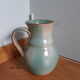 Pitcher with handle green celadon turquoise and caramel