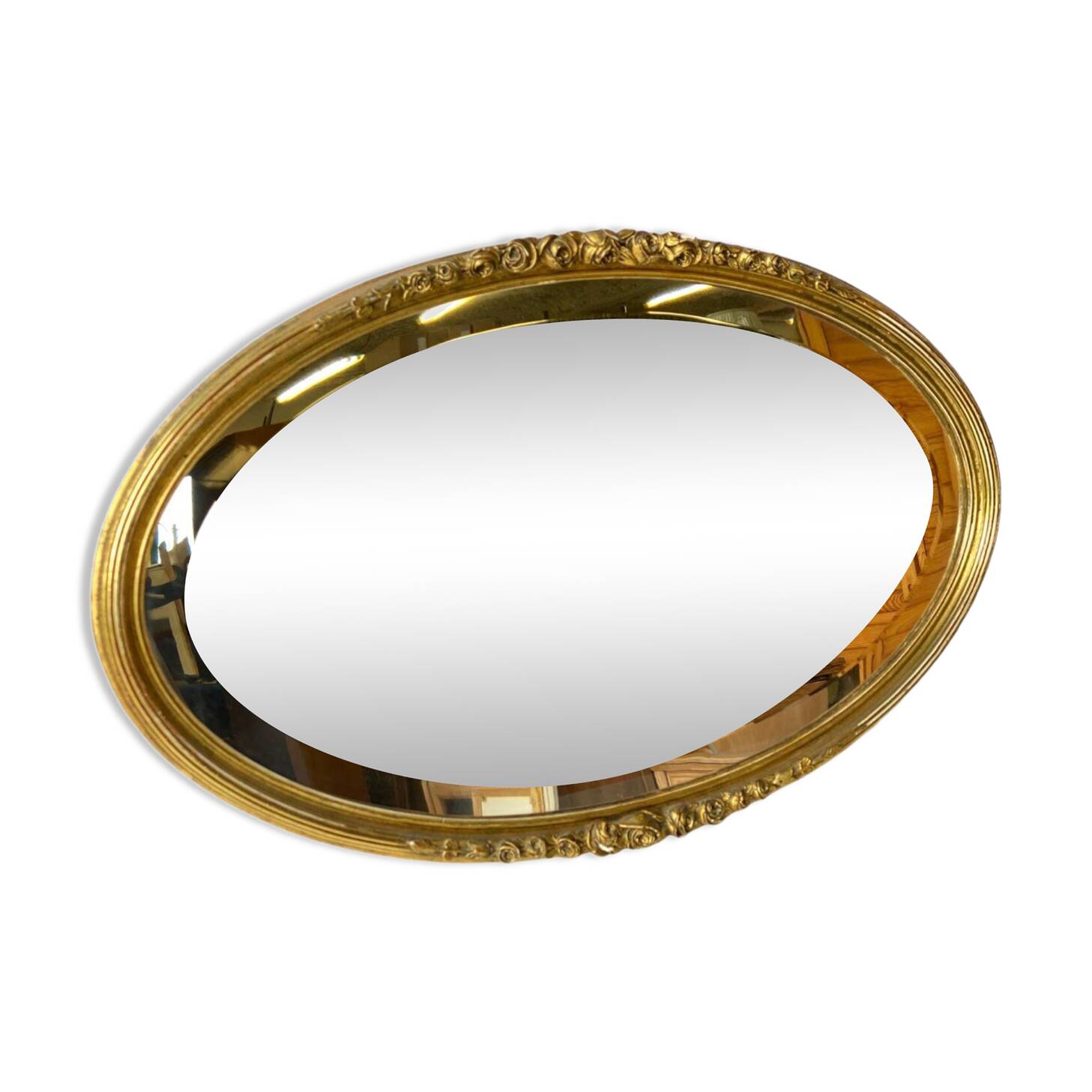 Vintage carved and gilded oval wall mirror