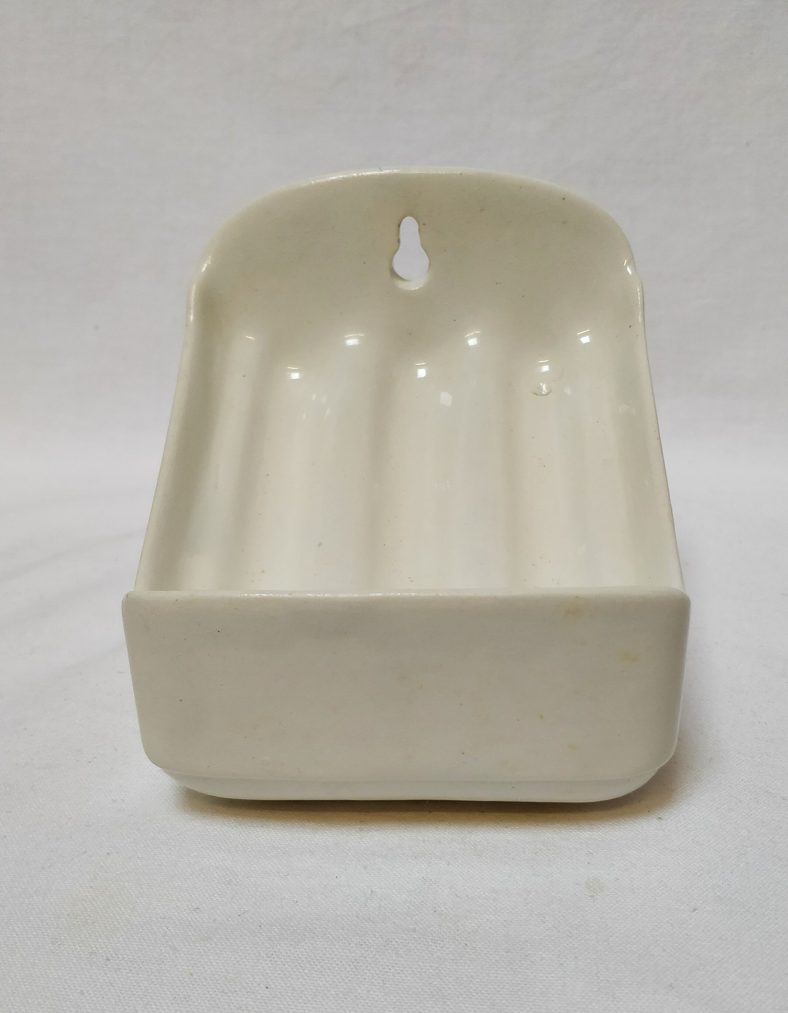 Wall-mounted ceramic soap holder