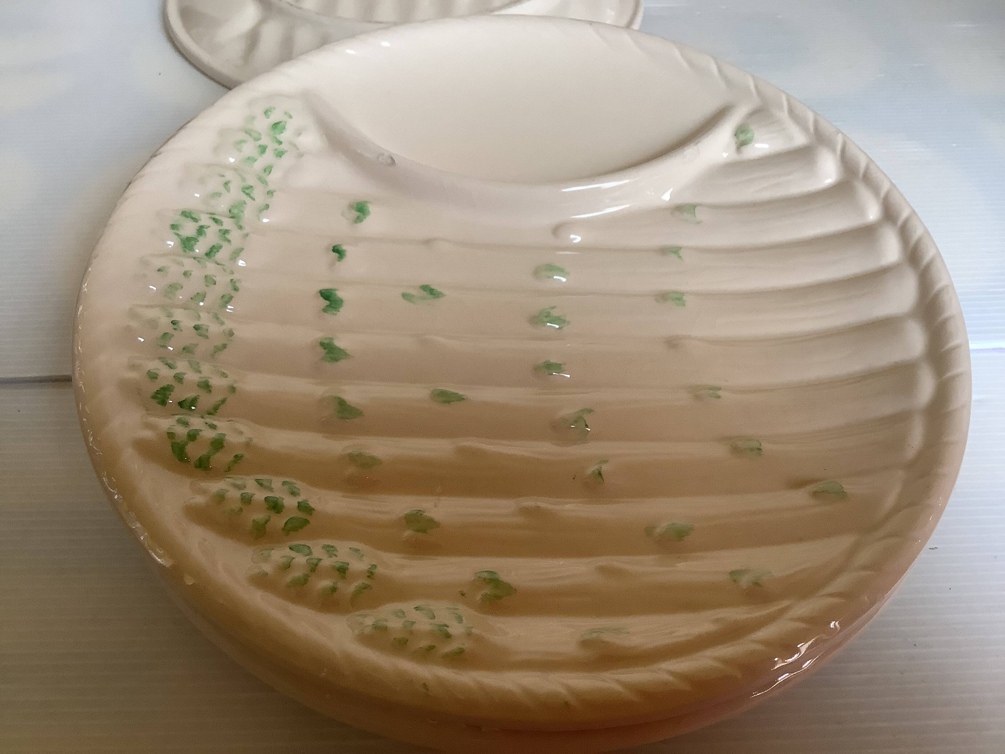 Six antique asparagus plates