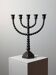 Candelabrum in the shape of a spool, skilfully forged in menorah style.