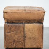 Sturdy square vintage sheepskin pouf/ottoman with beautiful colours