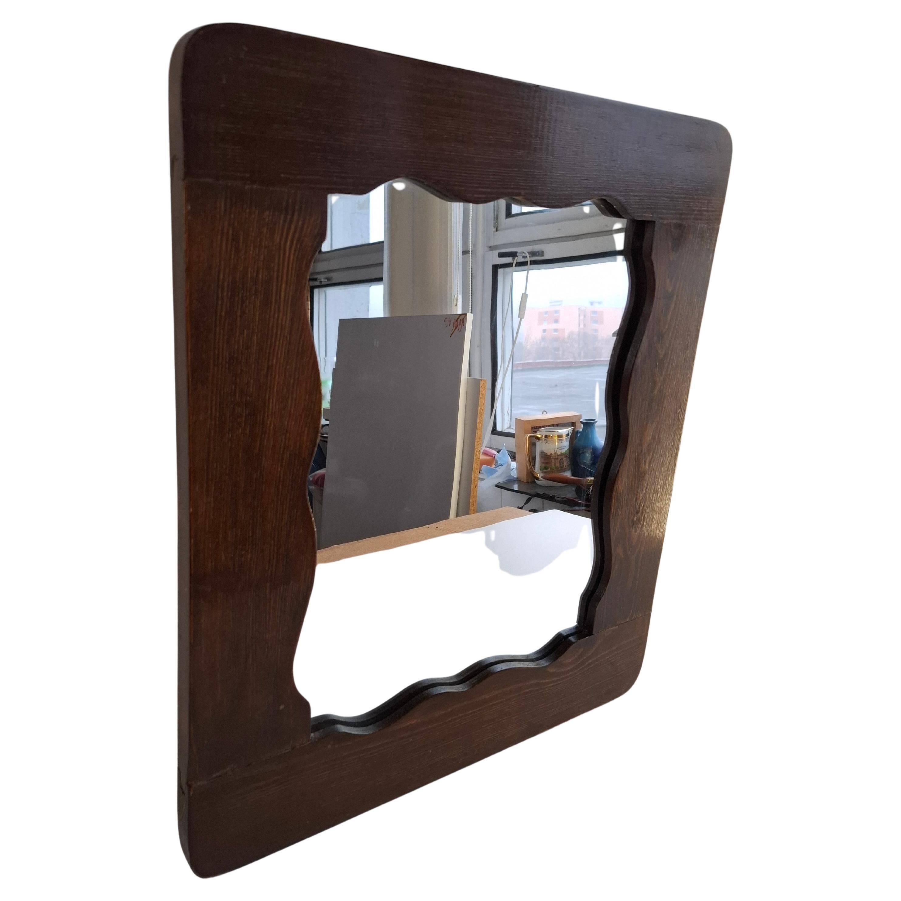 Czechoslovakian wall mirror with a wavy wooden frame, mid-century, 1940s