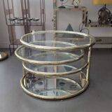 Gold brass coffee table with rotating trays.