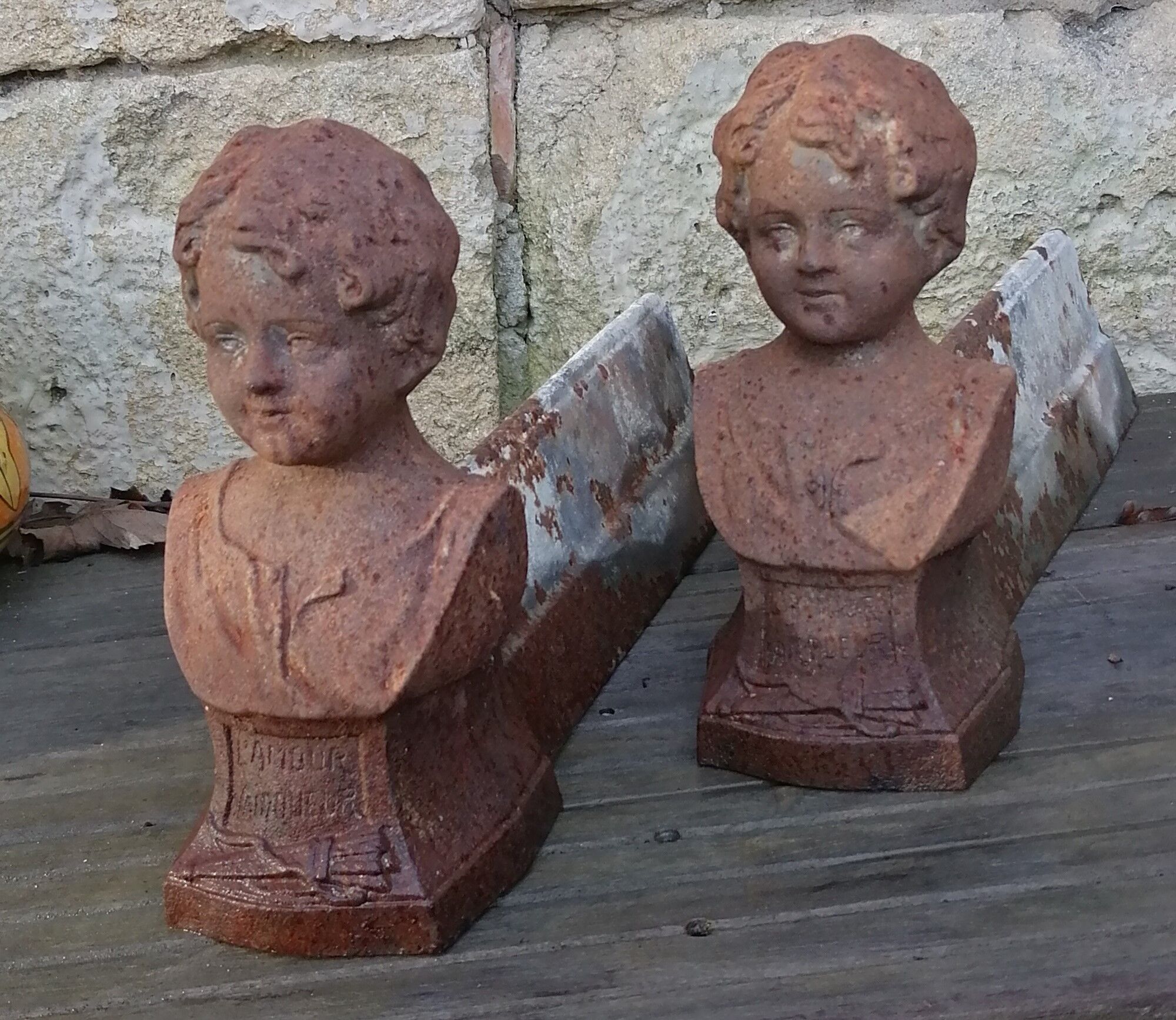 Pair of cast iron fireplace chenets "Children"