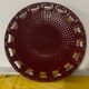 Burgundy and gold openwork plate in ceramic from Saint-Clement, 1950s.
