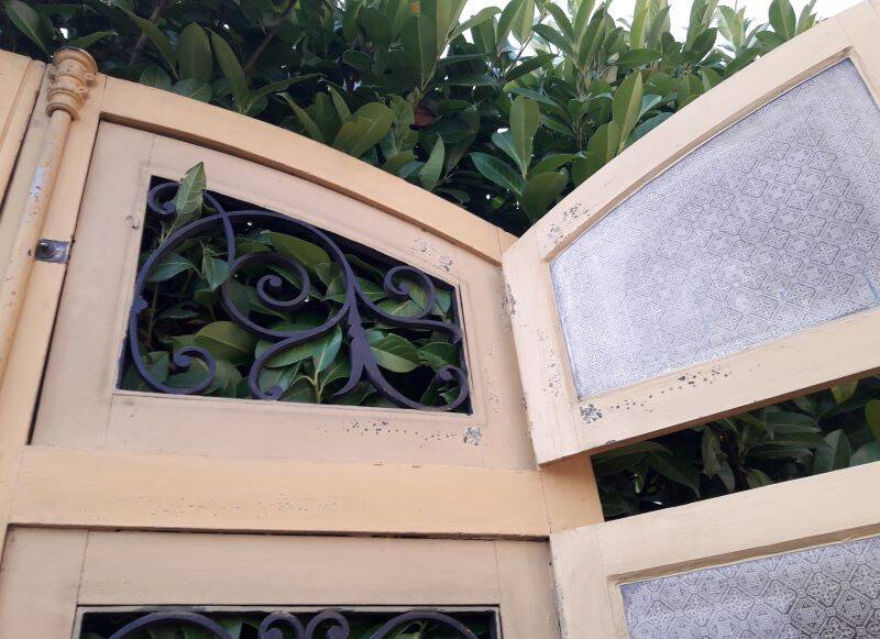 19th century double arched entrance door in oak with grilles and old glass
