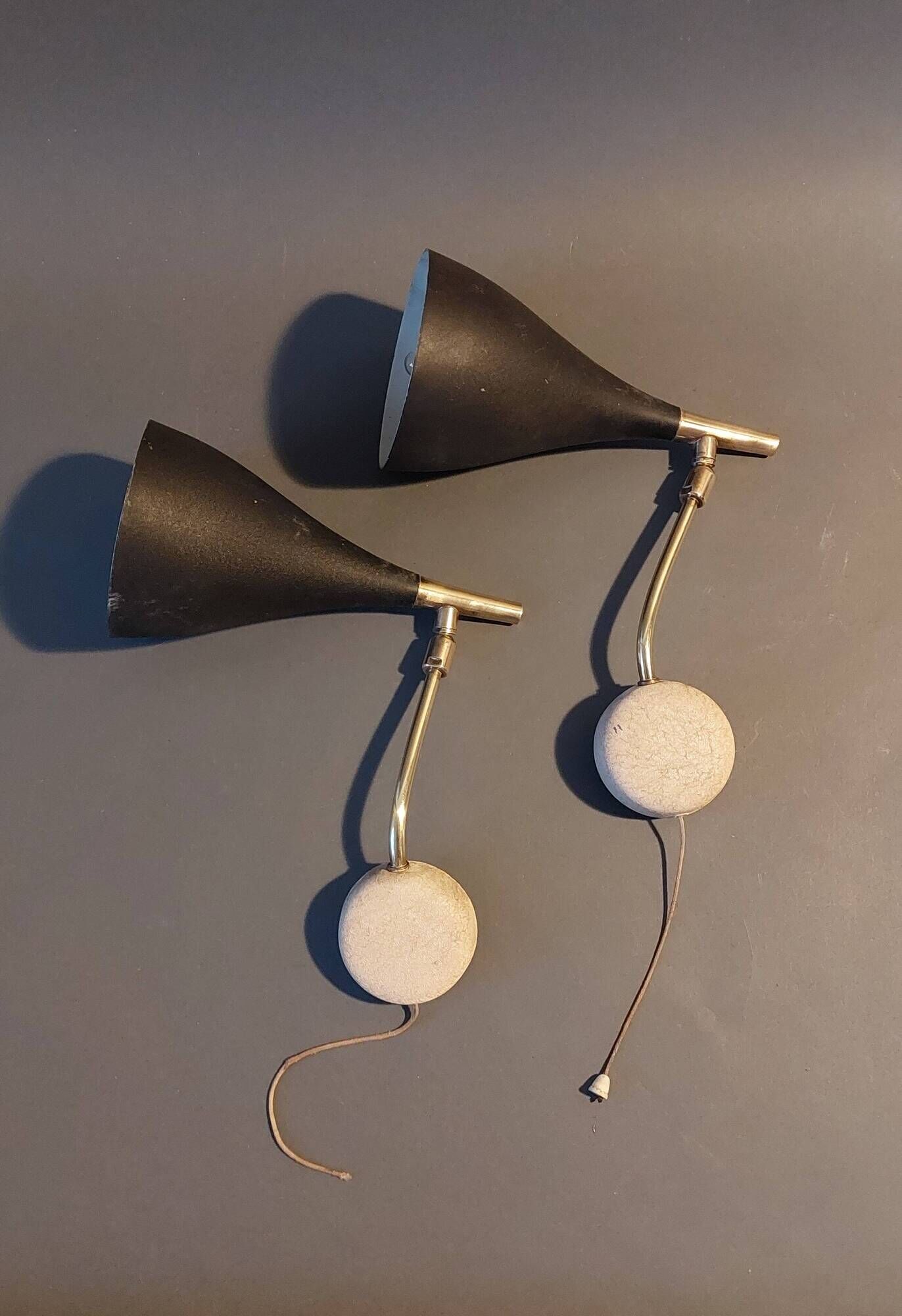 Pair of bedroom sconces in gilded brass and black aluminum 1960.