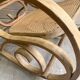 Rocking chair with a cane seat and backrest.