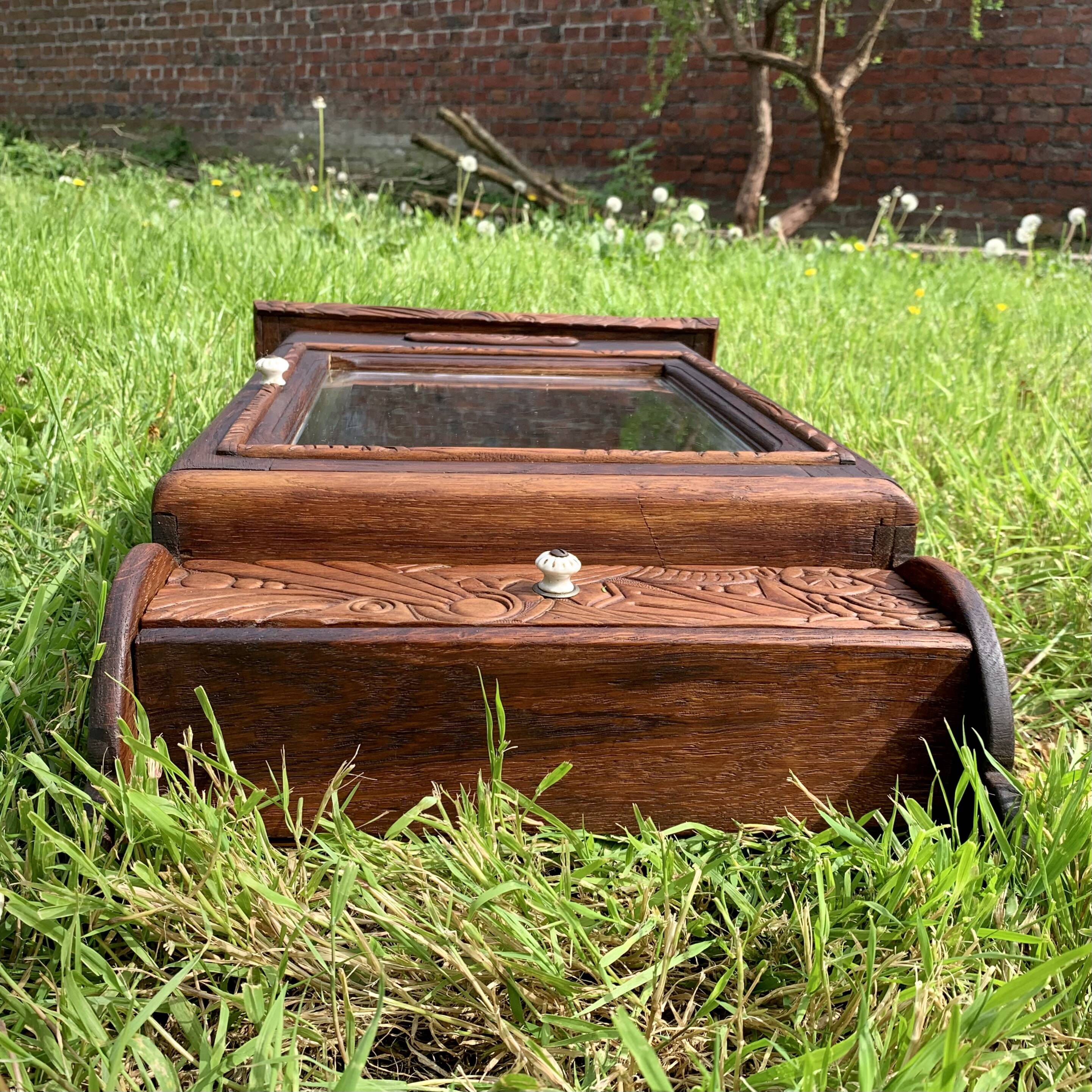 Old carved wooden medicine cabinet with beveled mirror