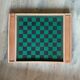 Old game of checkers and small horses