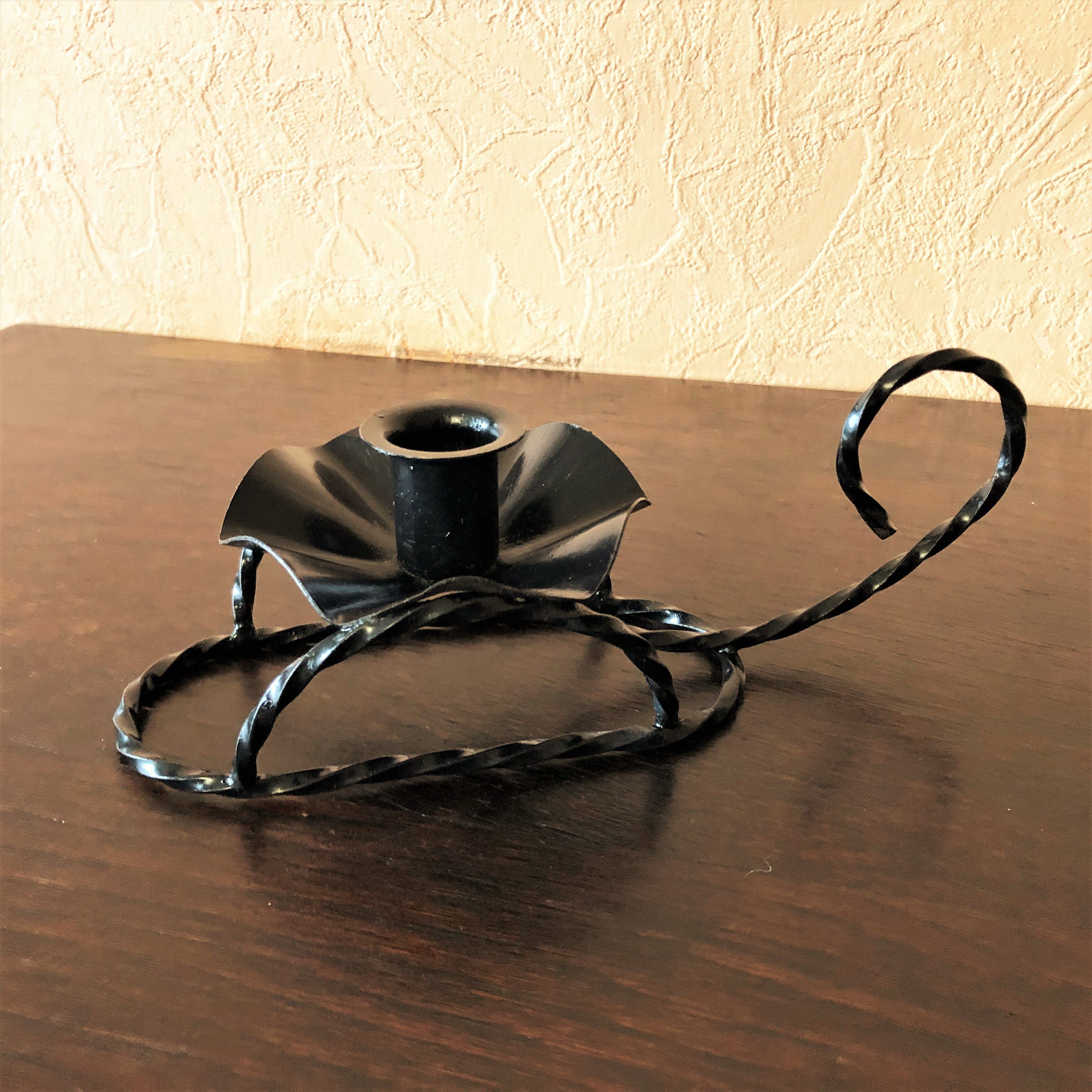 Handmade hand candle holder in vintage black wrought iron