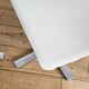 Extendable round table in white formica and 4 matching chairs by Roche Bobois.