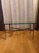 Small chrome and glass coffee table.