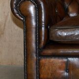 Restored leather Chesterfield sofa, walnut legs.