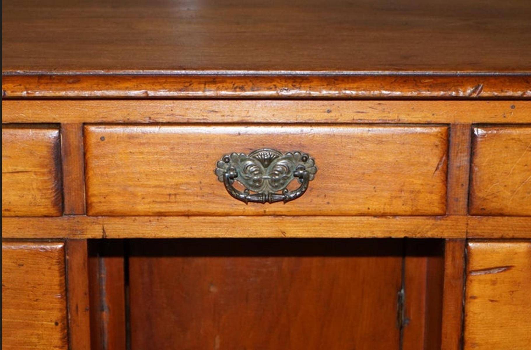 Small Victorian desk in solid walnut with drawers.