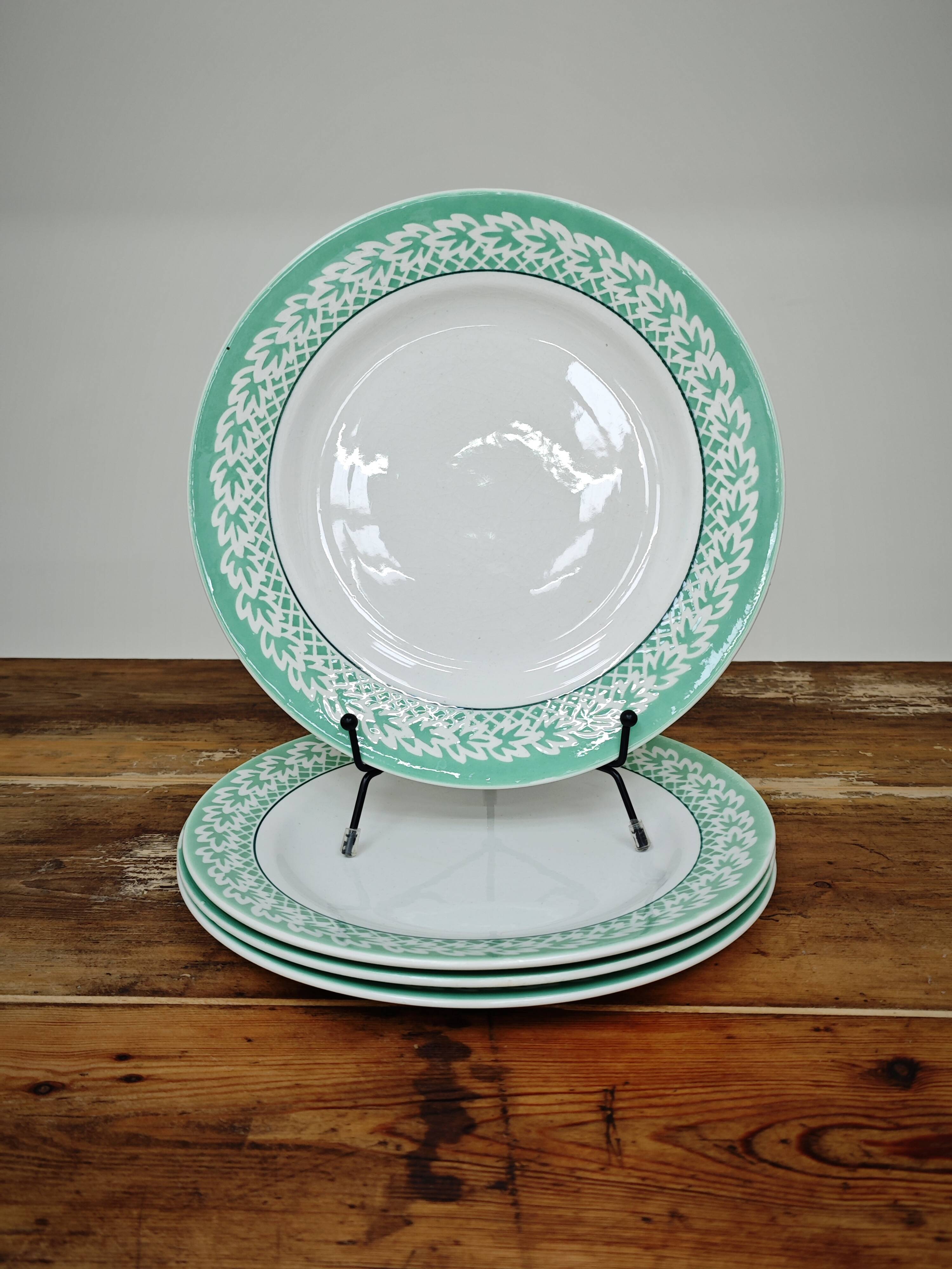Set of 4 KIFO L'Amandinoise flat plates with green leaf design.