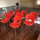 Lot de 8 chaises rouges vintage designer Raul Barbieri