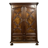 Louis XIII period armoire in molded walnut with decoration of reserves and quatrefoils circa 1700