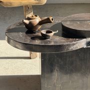 Brown petrified wood coffee table from Indonesia with a double circular top.