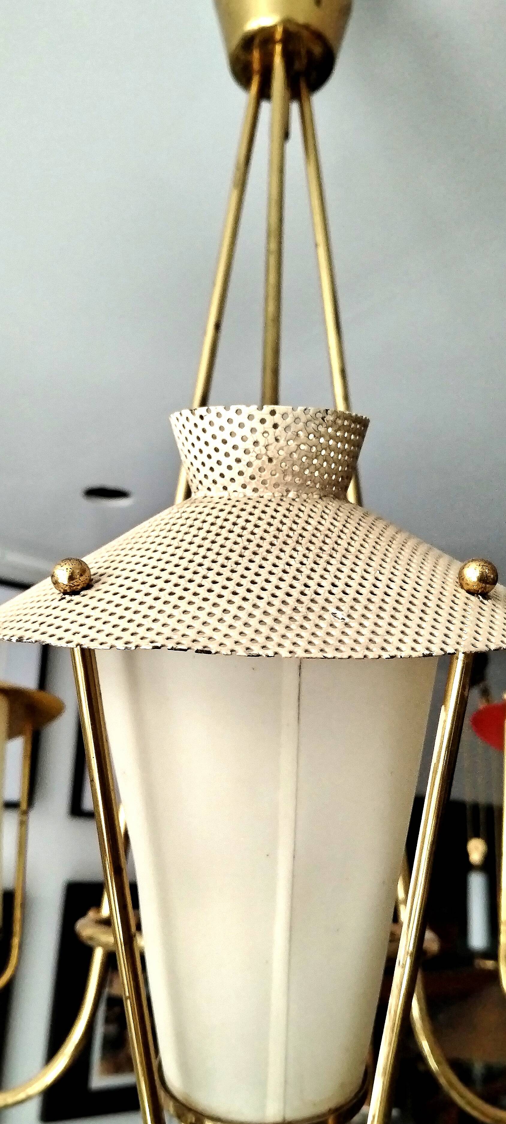 Three-arm pendant light in gilded brass and perforated metal by Maison Arlus Vintage from the 50s