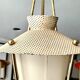 Three-arm pendant light in gilded brass and perforated metal by Maison Arlus Vintage from the 50s
