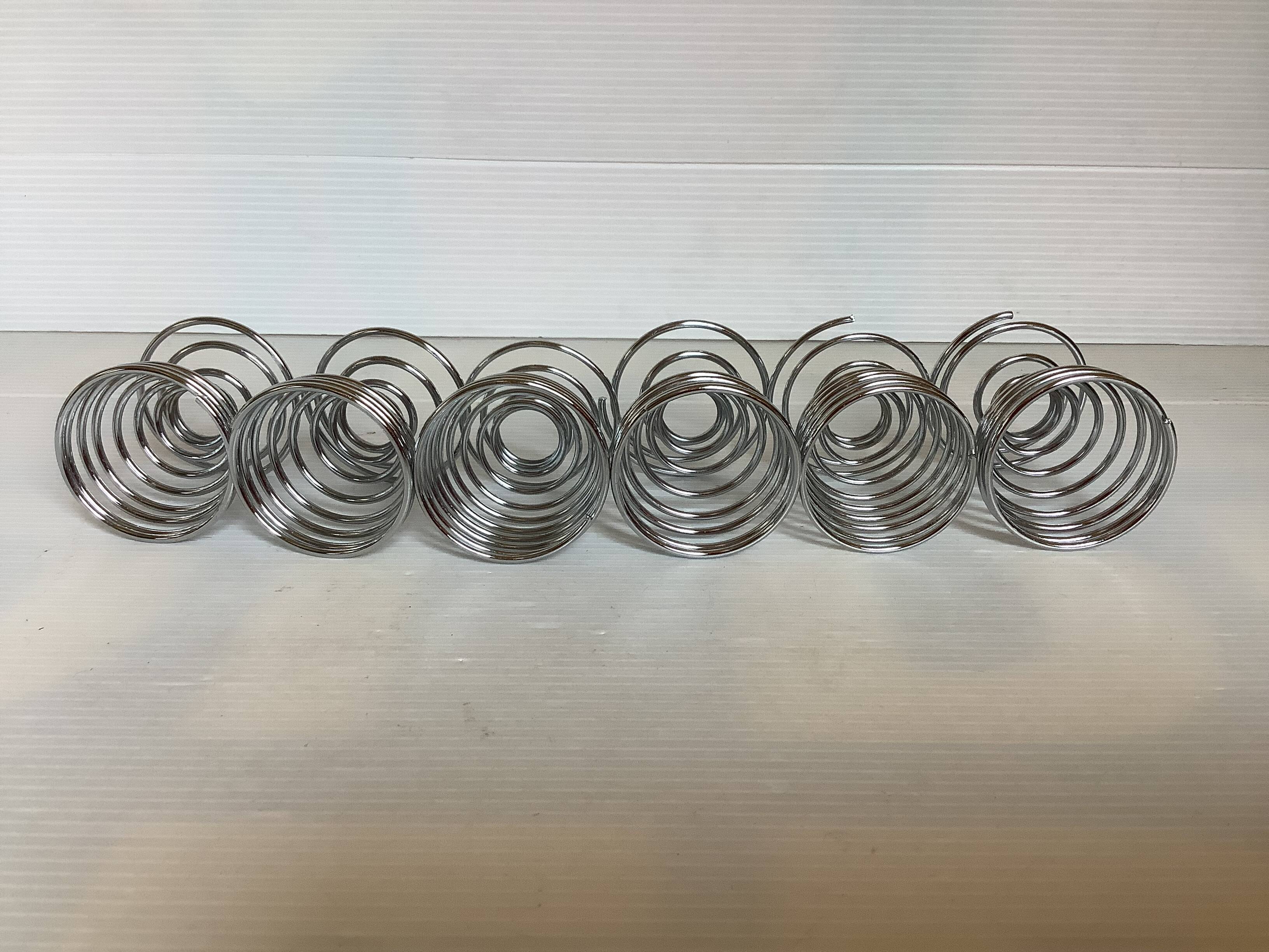 Six metal spiral spring egg cups