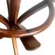 Vintage coat rack on floor in curved wood, thonet style