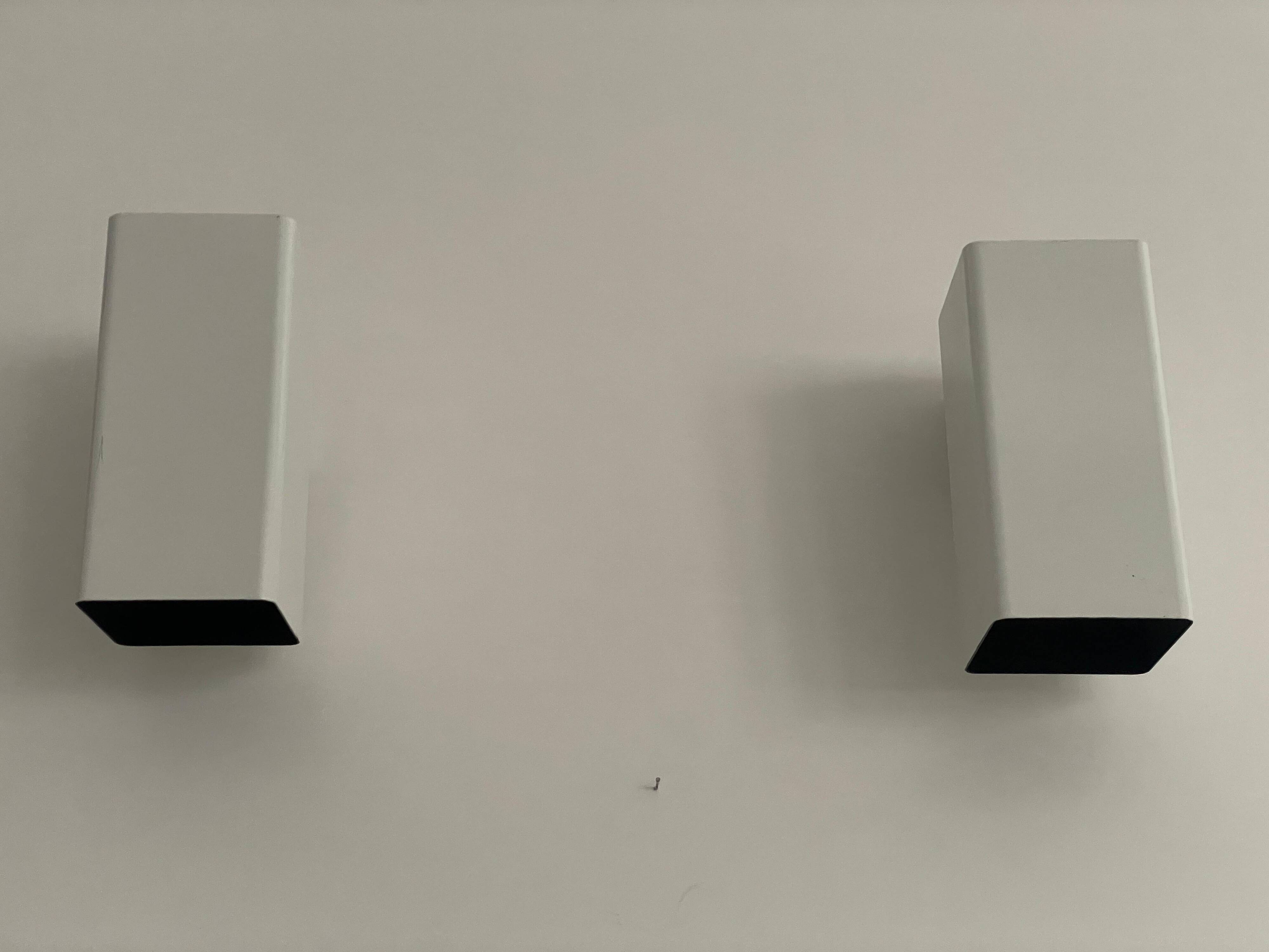 Pair of minimalist white metal wall lights from the mid-century, 1960, Germany.