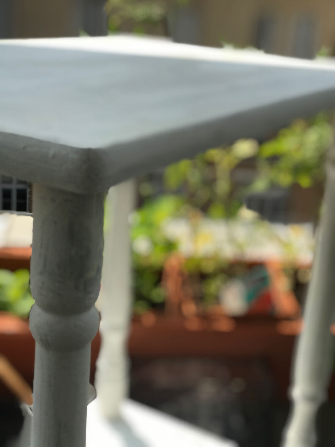 Vintage wooden side table with white patina