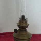 Old German kerosene lamp on foot in yellow copper period 19th German petroleum lamp